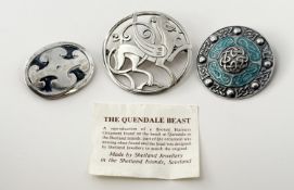 A George VI Birmingham silver targe brooch with turquoise blue enamel and pierced scrolling