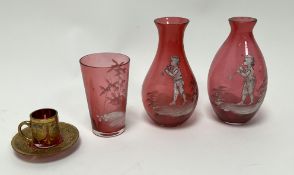 A collection of Mary Gregory 19thc cranberry glass with white enamel decoration, comprising a pair