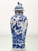A Chinese blue and white lidded baluster jar, with various scholar figures in an outdoor setting,