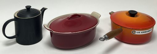 A collection of Le Creuset cooking wares, comprising a matte black grande coffee pot (h. 19cm), a