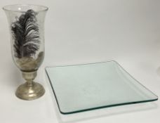 A large glass centerpiece of fluted square form (44cm x h. 6cm), together with a glass storm lantern