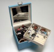 A modern turquoise blue jewellery box with a collection of costume jewellery to include a white