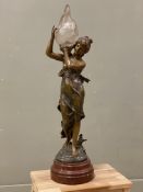 An Art Nouveau figural lamp, after Auguste Moreau, bronze finish with flame-shaped glass shade and