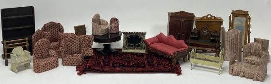 A collection of dollhouse furniture, comprising a Victorian style sofa with red upholstery and