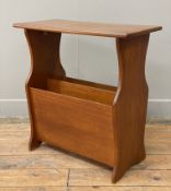 A mid-century teak magazine rack, rectangular top raised on trestle sides with magazine dividers