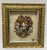 A Victorian mourning wreath with various shells and foliage, presented within a gilt box frame