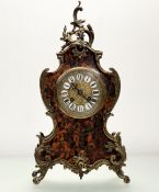 A 19thc French Rococo Revival Boulle mantle clock, with gilt scrolling metal mounts, with domed
