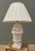 A Spanish ceramic table lamp, in the form of an urn with fruit, with pleated cream shade: H. exc