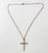 A 9ct gold engine turned engraved cross: l. x 3.5cm on a 9ct gold trace link chain with ring