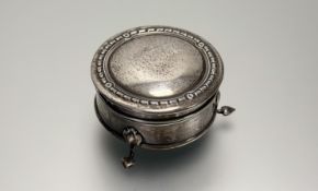 A George V Birmingham silver circualr dressing table ring box with engraved initials K.P.M.H. with