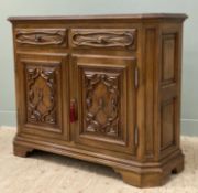 A modern hardwood console table, carved frieze drawers and cupboard doors to front enclosing shelf