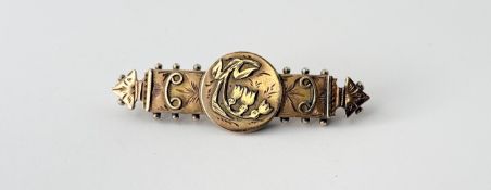 An Edwardian 9ct gold bar brooch with circualr Lily of the valley panel by engraved pales within a