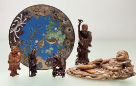A collection of wooden hand-carved chinese figures comprising, a foo dog with paw on ball (h-