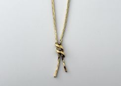 A 9ct gold box link cross over style necklace set two diamond points to knot with a clip fastening