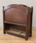 A 1930's oak stick stand, arched top with two dividers, raised on square supports: H. 65cm W. 60cm
