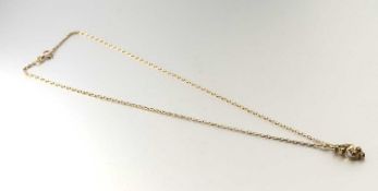 A 14k gold scrolling leaf pendant set six round brilliant cut paste stones: l. x 2cm 1.24g on a