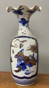 A Chinese blue and white vase, with flared neck over figures in a landscape (A/F previous