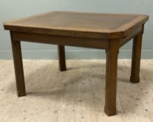 A 1920s oak draw-leaf dining table, rectangular top with twin leaves raised on square block