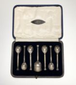A George V Sheffield silver set of six Ionic order capital terminal coffee spoons with matching