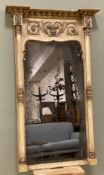 A 19th century Regency pier mirror, breakfront cornice and scrolled frieze over bevelled plate