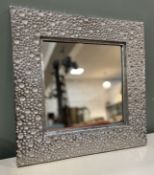 A contemporary square wall mirror with moulded all-over 'bubble' effect and silvered textured finish