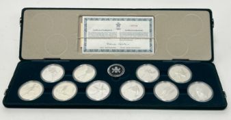 A Royal Canadian Mint Olympic set of nine twenty dollar sterling silver coins, no 103748: d. x 4cm