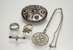 A Ortak silver circular pendant on trace link chain with ring fastening: d. x 3.5cm together with
