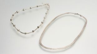 A modern silver snake link chain necklace with lobster claw fastening: l. x 21cm together with a
