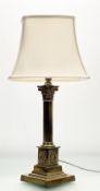 A late 19thc brass corinthian column table lamp, raised on a stepped square plinth base, with laurel