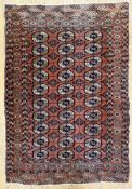 An antique hand-knotted Turkoman Tekke rug, circa 1900. Central panel with three rows of guls