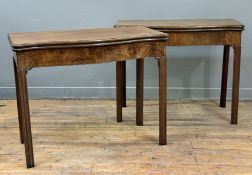 A pair of George III mahogany serpentine foldover card tables, last quarter of the 18th century,