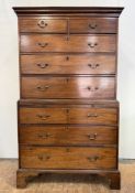 A George III mahogany chest on chest, the dentilled cornice above two short and three long graduated
