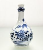 A Chinese blue and white porcelain bottle vase, 18th/19th century, painted with a fence and peony