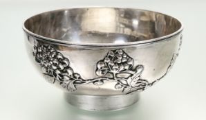 A Chinese silver centre bowl, bearing marks for Luen Wo, Shanghai, chased with chrysanthemums,