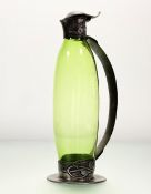 Archibald Knox (1864-1933), for Liberty & Co., a Tudric pewter-mounted green glass claret jug, c.