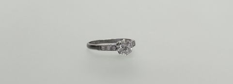 A single stone diamond ring, the round brilliant-cut stone weighing approx. 1ct, claw-set on