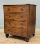 An early 19th century mahogany cupboard, the rectangular top over a single door carved to simulate