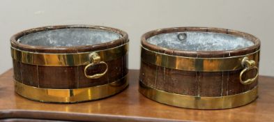 A pair of George III brass-bound coopered mahogany oyster buckets, circular, each with oval brass