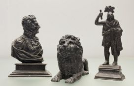 Three 19th century cast-iron doorstops: one cast as a portrait bust of the Duke of Wellington; a