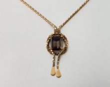 A Middle Eastern necklace pendant, the yellow metal box-link chain (stamped 