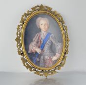 A portrait miniature of a young Bonnie Prince Charlie, depicted in elaborate coat wearing the sash