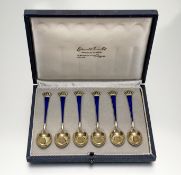 A cased set of six Danish sterling silver-gilt and enamel coffee spoons, import marks for 1961, each