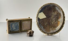 A group comprising: a mid-19th century brass double stamp box, with two hinged glazed covers, raised