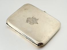 A George V regimental silver cigarette case, Birmingham 1913, the rectangular case engraved with the