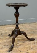 An early George III mahogany wine table, the circular dished top over a turned inverted baluster