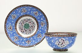 A Persian Qajar Manakari bowl and saucer, possibly late 19th century, the bowl decorated with exotic