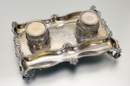 An Edwardian silver-gilt desk standish, Reid & Sons, London 1903, the twin glass wells with hinged
