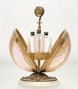 A 19th century French gilt metal mounted mother-of-pearl shell table-top scent casket, of Palais