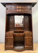 An Art Nouveau copper-mounted oak hall stand, in the manner of Liberty & Co., c. 1890, of tapering