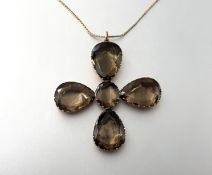 A 19th century cruciform pendant, the five stones of Cairngorm type, foil backed and set in 9ct rose